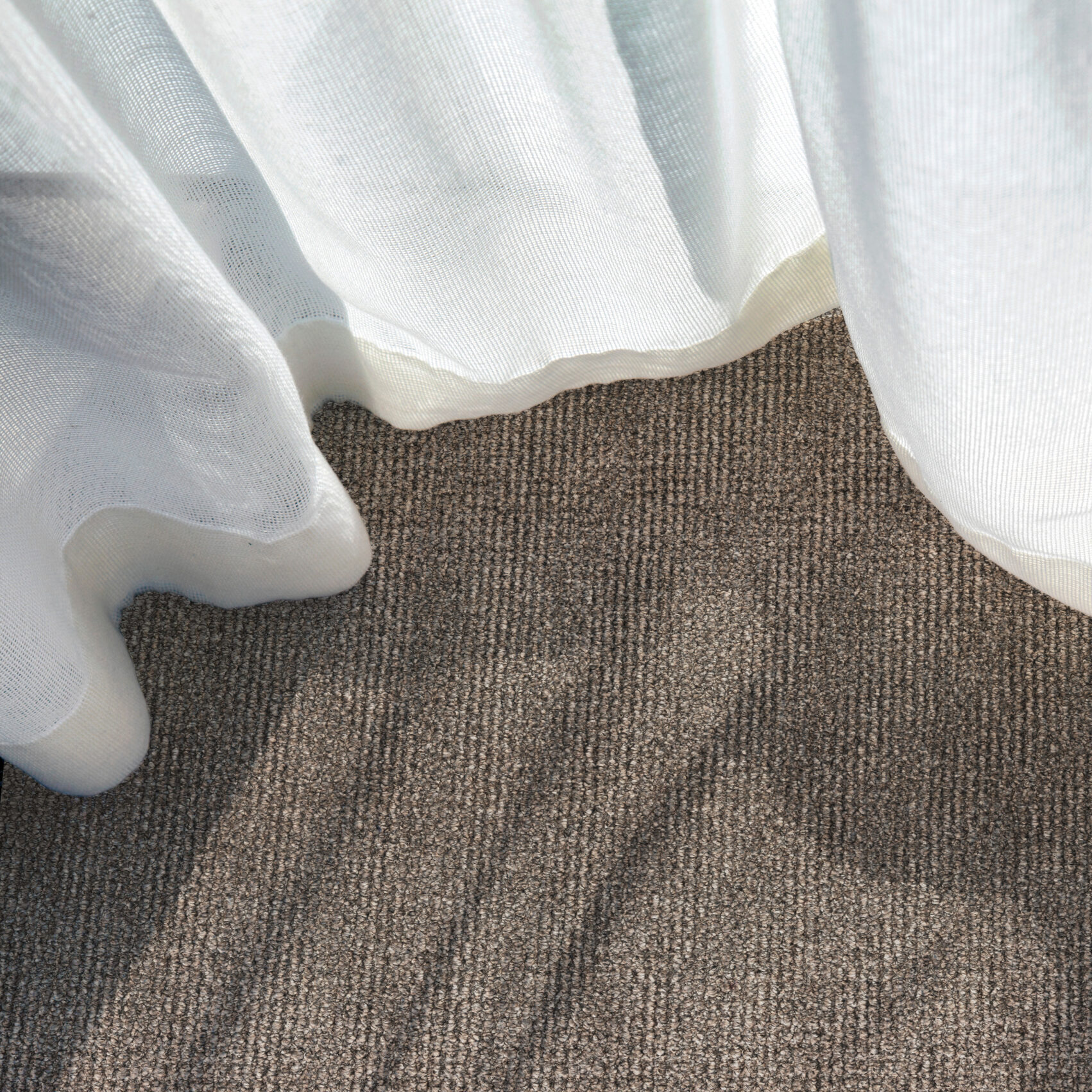 A close up shot of a curtain in a hotel room