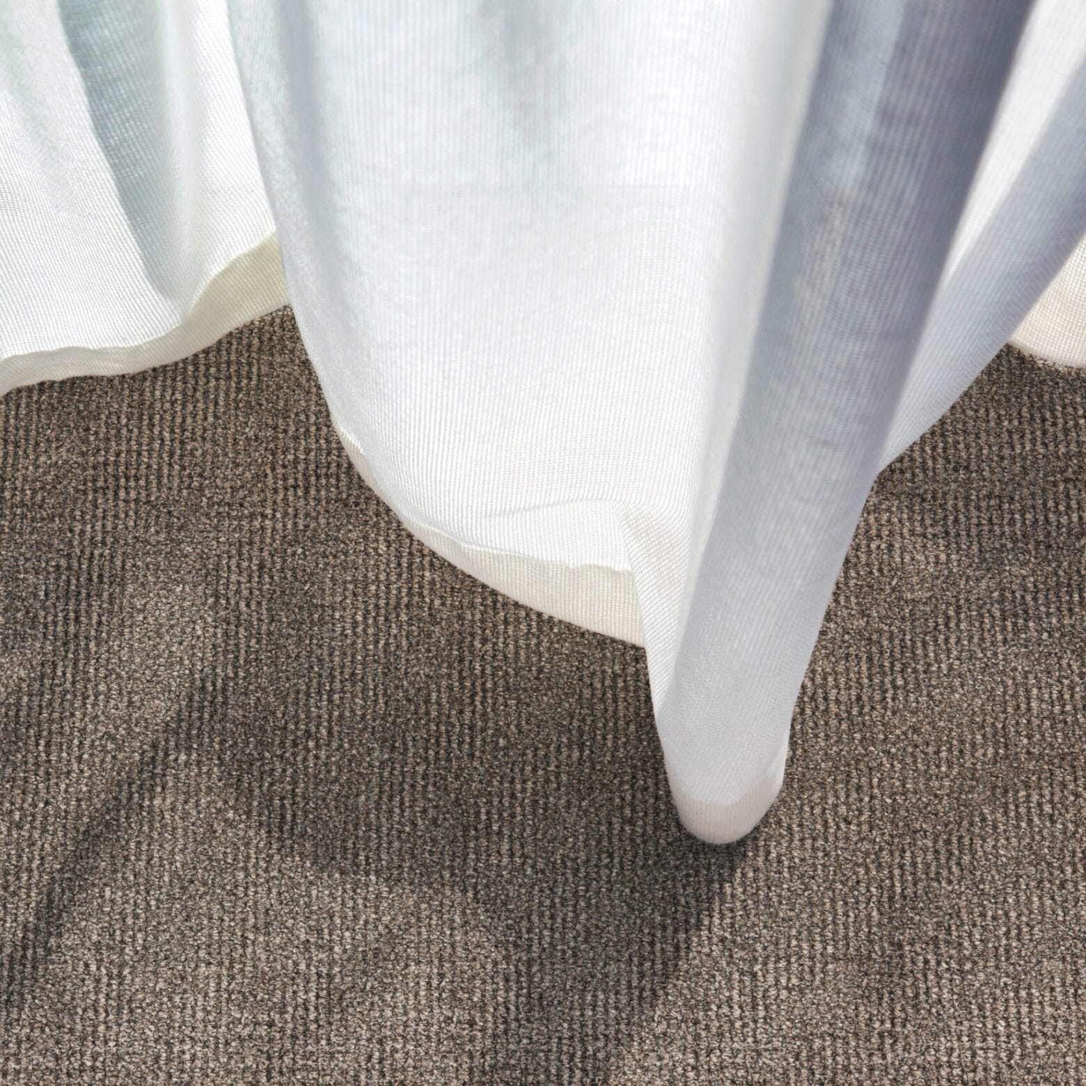 A close up shot of a curtain in a hotel room